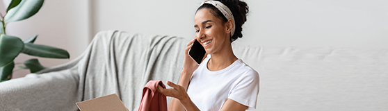 Woman smiling while talking on her cell phone